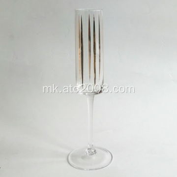 Шампањско флејта стакло со злато деклара